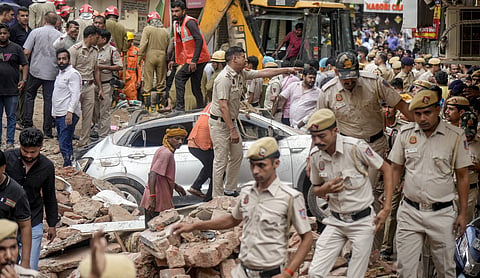 Police and rescue personnel work at the site of the Satya Niketan building collapse in New Delhi, NEW DELHI on Sunday, September 6. (PTI Photo)