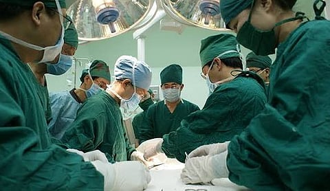Representational image: a surgical team in an operating room.