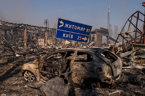 File photo: A view of a destroyed car amid damaged buildings after a Russian attack struck a warehouse, in the village of Myla, Kyiv region, KYIV. (AP Photo via PTI)