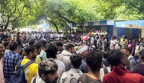 Sanitation workers stage a protest at the Municipal Corporation of Delhi headquarters / Source: PTI