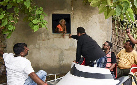 File photo: Flood-affected residents in Bihar. (PTI Photo)