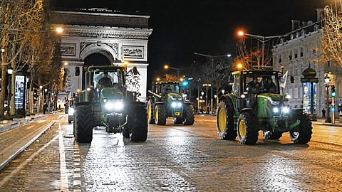 French farmers drive tractors to Parliament to protest low incomes