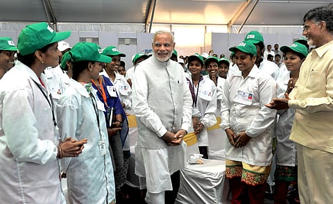 Representational image, file photo (2015): Prime Minister Narendra Modi meets workers at a mobile and electronics manufacturing hub in Tirupati. Photo: Prime Minister’s Office / Government of India (GODL-India).