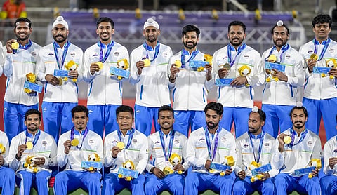 India players pose after winning the Asian Games men’s hockey gold, KAKAMIGAHARA on Saturday, October 3. (PTI Photo)
