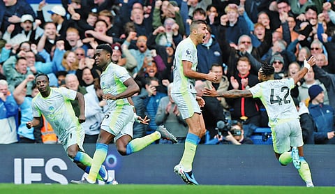 Man City closes in on Arsenal in Premier League title race with 3-0 win over Chelsea