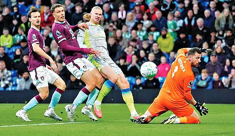 Man City tops Premier League as Haaland’s winner relegates Burnley