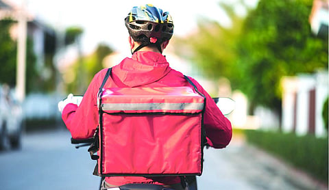 Man dies after being beaten with helmet by delivery agents