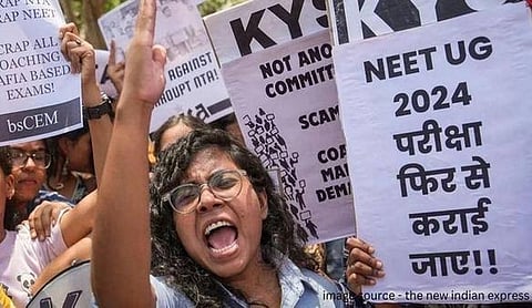 File photo: Students protest demanding a re-exam, holding placards. (PTI Photo)