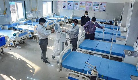 Representational image: Health workers inspect equipment in a hospital ward.