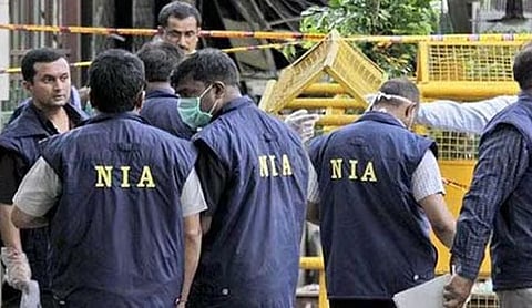 File photo: NIA officials at a search site. (PTI Photo)