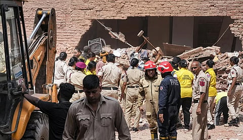 The collapsed building at Satya Niketan in south Delhi. PTI image