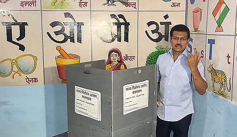 Rajasthan minister Rajyavardhan Singh Rathore casts his vote during the second phase of the urban local body elections. PTI photo