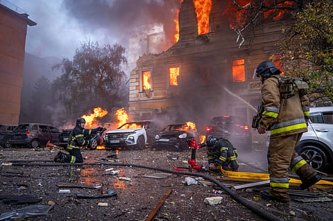 File photo: Rescue workers put out a fire at the National Academy of Sciences building damaged after a Russian drone strike, KYIV. (AP Photo via PTI)