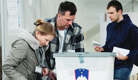 Slovenia’s governing liberals face right-wing populists in tight parliamentary election