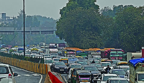 Steady rain, VIP-related curbs bring city traffic to standstill
