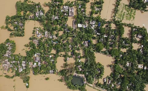 Floodwaters inundate villages in Odisha’s Balasore district as the Subarnarekha River rises above the danger mark. PTI image