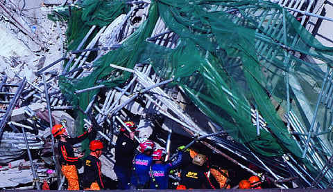 Three saved, four dead in Philippine hotel collapse