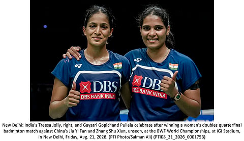 Treesa Jolly and Gayatri Gopichand celebrate after assuring India of a medal at the World Championships. | PTI photo