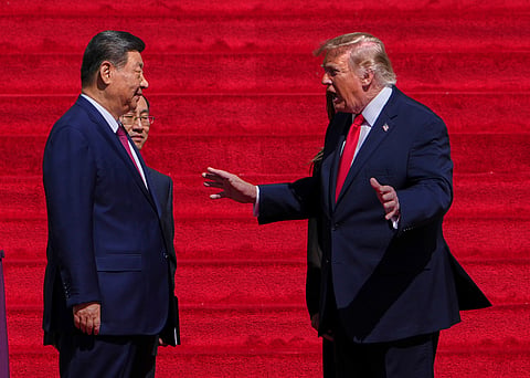 File photo: US President Donald Trump speaks with Chinese President Xi Jinping in Washington. (AP Photo via PTI)
