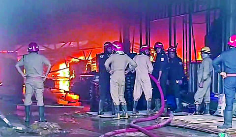 Two separate factory fires, six injured after panic jump