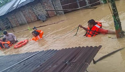 Representational image: Rescue personnel evacuate people from flooded homes.