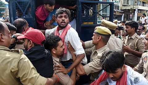 Police detain Samajwadi Party workers during a protest over Gonda trader Vinod Kumar Sahani’s killing in Lucknow on Friday, September 11, 2026. (PTI Photo)