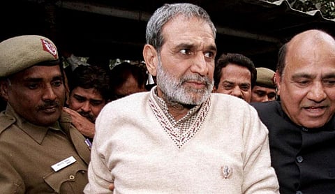 Sajjan Kumar being taken into custody by police. | Image source: PTI