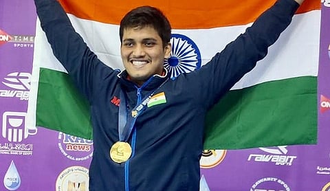 File photo: Shooter Rudrankksh Patil celebrates with a medal and the Indian flag, MUMBAI. (PTI Photo)