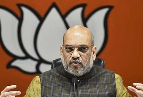 கர்நாடகாவில் 52 பேர் அடிமைகளாக உள்ளனர்; அரசு அமைச்சரவை விரிவாக்கத்தில் ஈடுபடுகிறது: அமித்ஷா குற்றச்சாட்டு