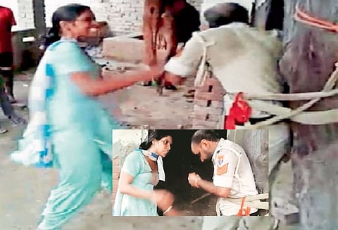 மரத்தில் கட்டி வைத்து போலீஸ்காரரை அடித்து உதைத்த பெண்