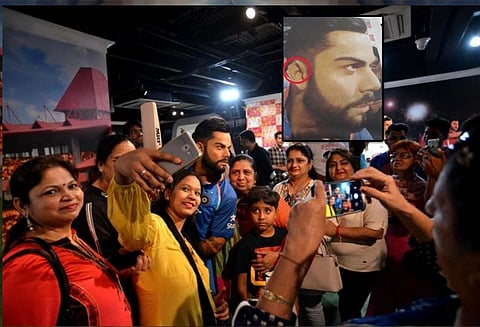 போட்டிப் போட்டு செல்பி வீராட் கோலியின் மெழுகு சிலையின் காது பகுதி உடைந்தது