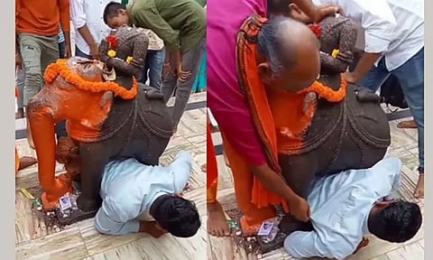 அதீத பக்தி யானை சிலைக்கு அடியில் படுத்து வழிபாடு செய்தபோது, சிக்கிக்கொண்ட இளைஞர்