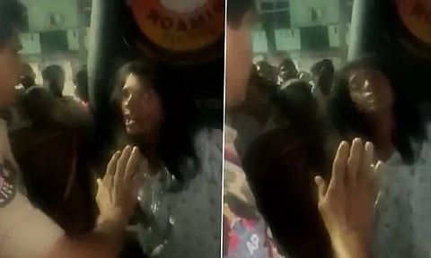 சாலையில் அமர்ந்து ஒய்யாரமாக மது குடித்த இளம்பெண்: தட்டி கேட்ட இன்ஸ்பெக்டர் மீது சரமாறி தாக்குதல்