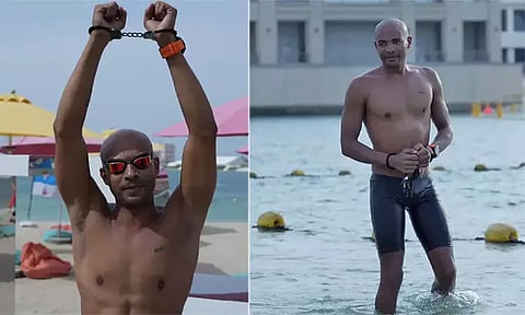 மனித சக்தியால் முடியாதது ஒன்றுமில்லை: கை விலங்கோடு கடலில் 11 கி.மீ நீந்தி உலக சாதனை படைத்த நீச்சல் வீரர்!