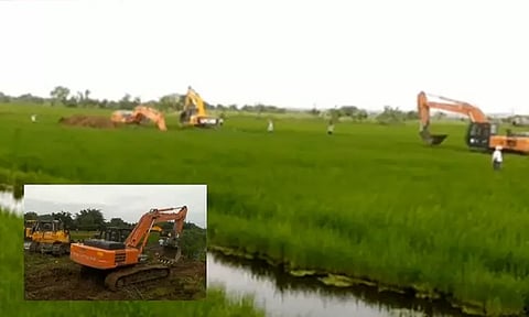 விளைநிலங்களை அழித்து கால்வாய் வெட்டும் பணிகளை தொடங்கிய என்.எல்.சி. நிர்வாகம் - கிராம மக்கள் எதிர்ப்பால் பதற்றம்