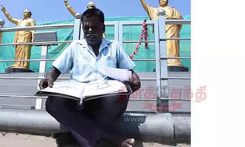 கரூர் லைட்ஹவுஸ் கார்னரில் திருச்சி தொழிலாளி தர்ணா