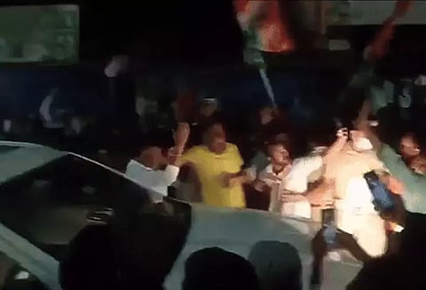 காங்கிரஸ் தொண்டரை அறைந்த துணை முதல்-மந்திரி; பா.ஜ.க. வெளியிட்ட வீடியோவால் பரபரப்பு