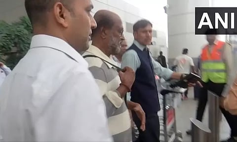 Rajinikanth greets fans as he reaches delhi airport after spiritual trip to Himalayas