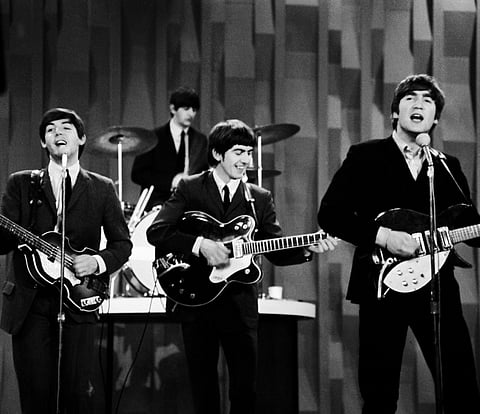 The Beatles, from left, Paul McCartney, Ringo Starr, George Harrison and John Lennon, perform for the CBS "Ed Sullivan Show" in New York, as they record a set on Feb. 9, 1964,AP Photo
