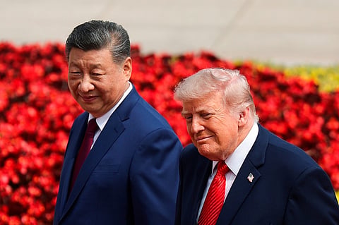 US President Donald Trump, right, and Chinese President Xi Jinping attend a welcome ceremony at the Great Hall of the People in Beijing, Thursday, May 14, 2026. 