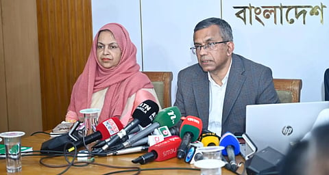 Bangladesh Bank Governor Md Mostaqur Rahman (R) speaking at a press conference in the capital. 