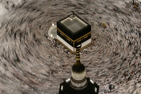 This photograph made with a slow shutter speed shows Muslim pilgrims circumambulating the Kaaba during the annual Hajj pilgrimage in Mecca, Saudi Arabia, Sunday, May 24, 2026
