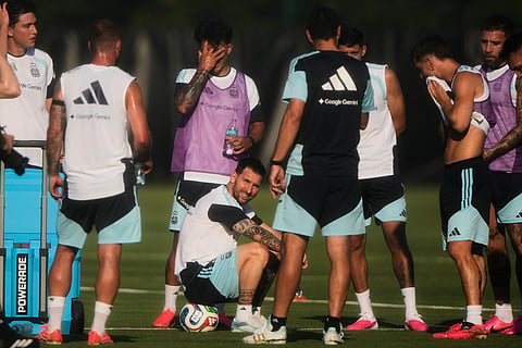 Argentina forward Lionel Messi, sitting, takes a break with teammates during practice for the FIFA World Cup soccer Wednesday, June 3, 2026, in Kansas City.