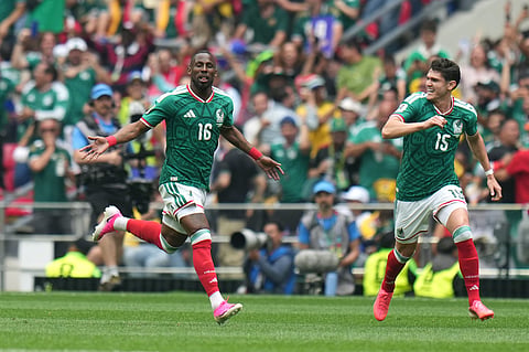 Mexico's Julian Quinones (16) celebrates with Israel Reyes after scoring their opening goal against South Africa during the World Cup opening match in Mexico City, Thursday, June 11, 2026. 