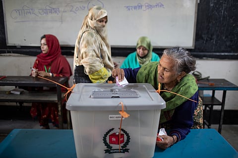 A voter casting her vote during the February 12 general election of Bangladesh