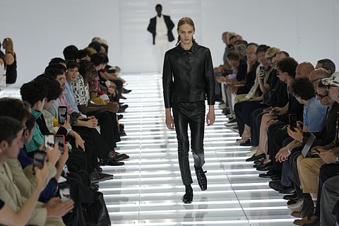 A model wears a creation from Prada’s Spring/Summer 2027 men’s collection presented in Milan, Italy, Sunday, June 21, 2026. 
