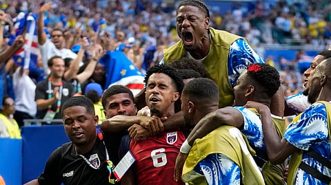 Cape Verde's Kevin Pina (c) celebrates with teammates after scoring the opening goal during the World Cup Group H match between Uruguay and Cape Verde in Miami Gardens, Florida on Monday.