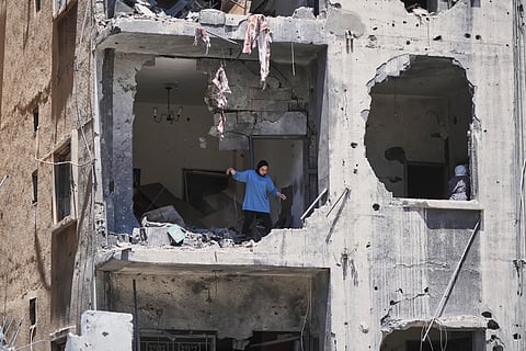 A woman walks through her apartment damaged in Israeli strikes in the southern port city of Tyre, Lebanon, Thursday, 18 June, 2026.