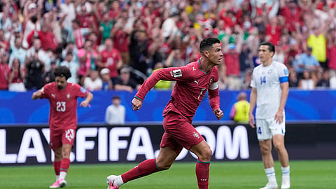 Cristiano Ronaldo celebrates after scoring the opening goal during the World Cup Group K football match between Portugal and Uzbekistan in Houston on Tuesday