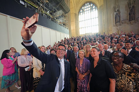 Andy Burnham with colleagues from the Parliamentary Labour Party in Westminster Hall at the Houses of Parliament in central London, as he returns to the House of Commons to take up his seat after winning the Makerfield by-election, Monday, 22 June 2026. 